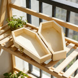 Natural pine pet memorial urn with its lid open in daylight